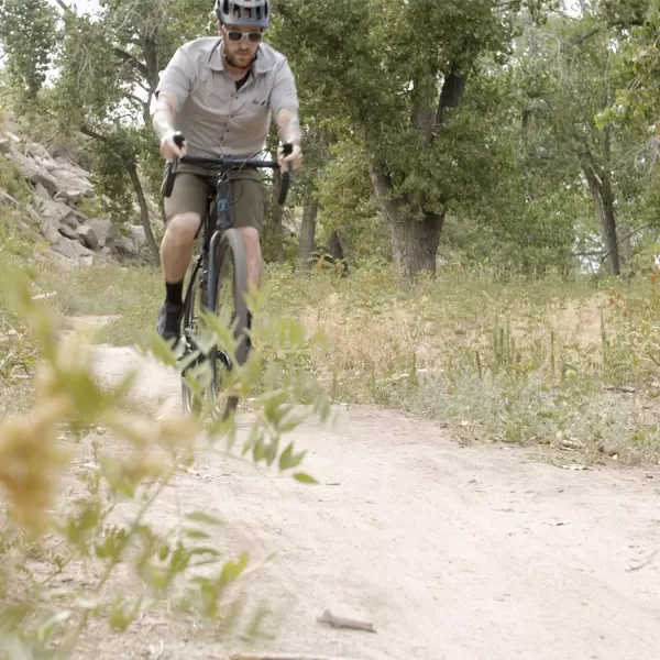 imageTommaso Siena Gravel Bike Shimano Tourney Adventure Bike with Disc Brakes Extra Wide Tires Perfect for Road Or Dirt Touring Matte Black BlueBlackBlue