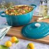 imageCrockPot Artisan Oval Enameled Cast Iron Dutch Oven 7Quart Scarlet RedTeal Ombre