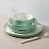 imageSur La Table Kitchen Essentials 16 Piece TwoTone Porcelain Chip and Scratch Resistant Dinnerware Plates and Bowls Set  RedWhiteGreenWhite
