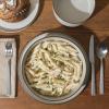 imageGibson Elite Island Cove 16 Piece Service for 4 Plates and Bowls Reactive Glaze Organic Round Dishes Stoneware Ceramic Dinnerware Set GreenGelston Cream