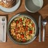 imageGibson Elite Island Cove 16 Piece Service for 4 Plates and Bowls Reactive Glaze Organic Round Dishes Stoneware Ceramic Dinnerware Set GreenGelston Green