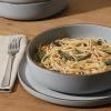 imageGibson Elite Island Cove 16 Piece Service for 4 Plates and Bowls Reactive Glaze Organic Round Dishes Stoneware Ceramic Dinnerware Set GreenGelston Grey
