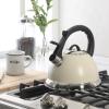 imageMr Coffee Clarefield 24 Qt Whistling Tea Kettle  Matte Black Stovetop Water Kettle with Lid HeatResistant Nylon Handle and Knob Stainless Steel TrimLinen White