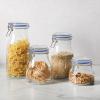 image:imageSur La Table Lyon Court 4Piece Glass Canister Set with Airtight Trigger Clamp Lids Clear  71 oz 54 oz 37 oz amp 225 oz Sizes Rubber Gasket Seal Dishwasher Safe Food Storage JarsSet of 4 71 oz  54 oz  37 oz  225 oz