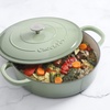 image:imageCrock Pot Artisan 5Quart Enameled Cast Iron Braiser Pan With Oven Safe Borosilicate Glass Lid Everyday Covered Skillet for Searing Roasting and Baking RedPistachio