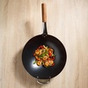 image:imageSUR LA TABLE Kitchen Essentials Quick Fire 135 Carbon Steel Flat Bottom Wok  Durable Nonstick Stir Fry Pan