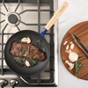 image:imageSur La Table Kitchen Essential Main Canteen 95 PreSeasoned Cast Iron Skillet wWood Handle Natural Nonstick Lightweight Frying Pan for Searing Sauting amp Everyday Cooking  BlueBlue Skillet