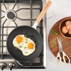 image:imageSur La Table Kitchen Essential Main Canteen 95 PreSeasoned Cast Iron Skillet wWood Handle Natural Nonstick Lightweight Frying Pan for Searing Sauting amp Everyday Cooking  BlueEggshell White Skillet
