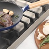 image:imageSur La Table Kitchen Essential Main Canteen 95 PreSeasoned Cast Iron Skillet wWood Handle Natural Nonstick Lightweight Frying Pan for Searing Sauting amp Everyday Cooking  BlueBlue Skillet
