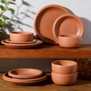 image:imageBloomhouse  Two Time Oprahs Favorite Things Winner  Corsica Clay 12 Piece Stoneware Rustic Reactive Glaze Dinnerware Set  Stackable Plates and Bowls Set Service for 4  Matte Sea Salt WhiteBurnt Apricot Terracotta