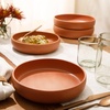 image:imageBloomhouse  Two Time Oprahs Favorite Things Winner  Corsica Clay 12 Piece Stoneware Rustic Reactive Glaze Dinnerware Set  Stackable Plates and Bowls Set Service for 4  Matte Sea Salt WhiteBurnt Apricot Terracotta