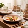 image:imageBloomhouse  Two Time Oprahs Favorite Things Winner  Corsica Clay 12 Piece Stoneware Rustic Reactive Glaze Dinnerware Set  Stackable Plates and Bowls Set Service for 4  Matte Sea Salt WhiteProsecco Blush Pink