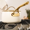 image:imageBloomhouse 15Piece Ceramic Nonstick Cookware Set Two Time Oprahs Favorite Things HeavyGauge Aluminum Pots and Pans Set PFAS amp PFOA amp PTFE Free Ceramic Cookware Oven Safe to 500F CappuccinoAlmond Cream w Gold Handle