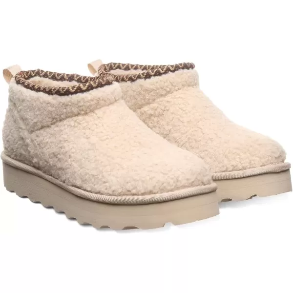 imageBEARPAW Womens Snuggle Daphne Deco Boot  Womens Ankle Boot  Womens Slip On Boot  Comfortable Winter BootOat