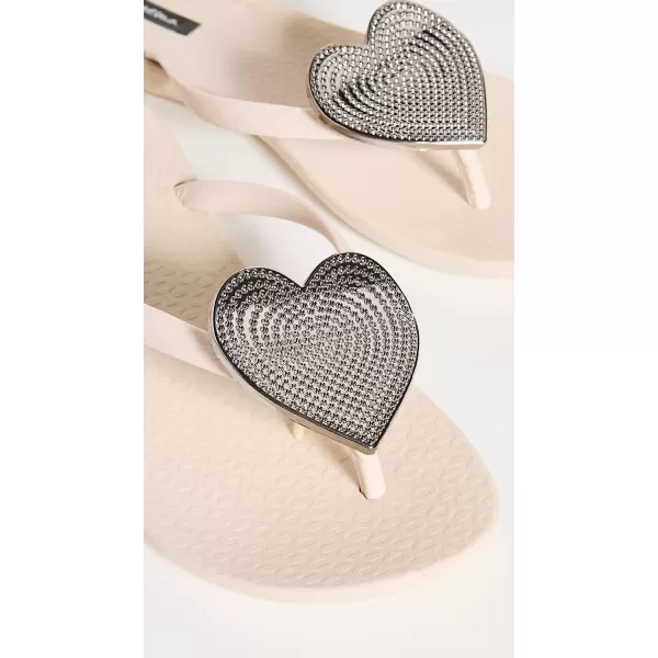 imageIpanema Womens Wave Heart Flip Flop  Comfortable amp Stylish Summer Sandal with Metallic Heart Embellishment Anatomic Footbed amp NonSlip SoleBeigeSilver