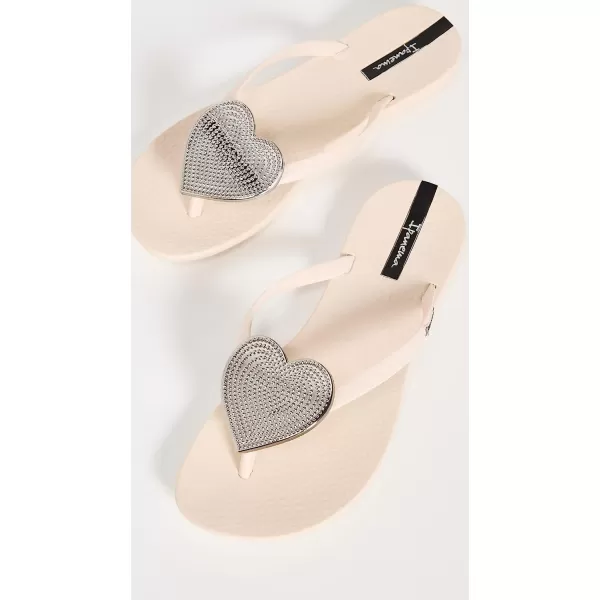 imageIpanema Womens Wave Heart Flip Flop  Comfortable amp Stylish Summer Sandal with Metallic Heart Embellishment Anatomic Footbed amp NonSlip SoleBeigeSilver