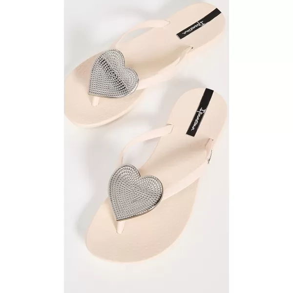 imageIpanema Womens Wave Heart Flip Flop  Comfortable amp Stylish Summer Sandal with Metallic Heart Embellishment Anatomic Footbed amp NonSlip SoleBeigeSilver