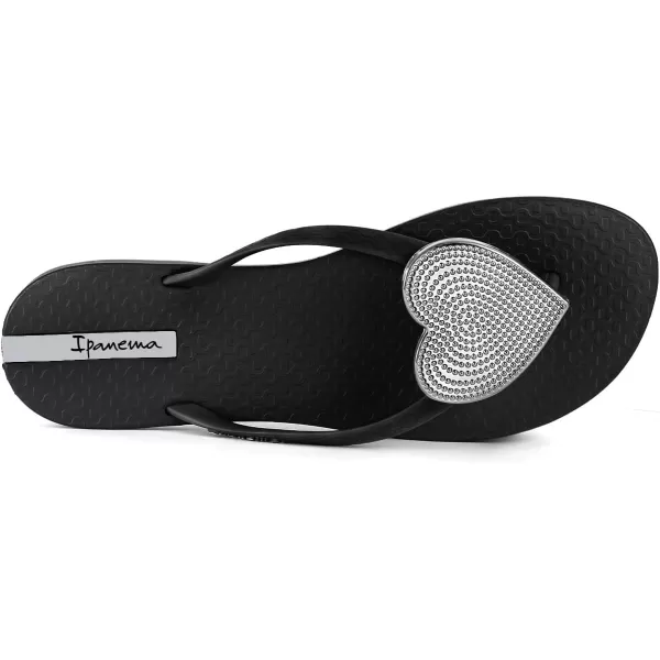 imageIpanema Womens Wave Heart Flip Flop  Comfortable amp Stylish Summer Sandal with Metallic Heart Embellishment Anatomic Footbed amp NonSlip SoleBlackSilver