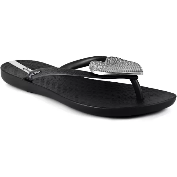 imageIpanema Womens Wave Heart Flip Flop  Comfortable amp Stylish Summer Sandal with Metallic Heart Embellishment Anatomic Footbed amp NonSlip SoleBlackSilver