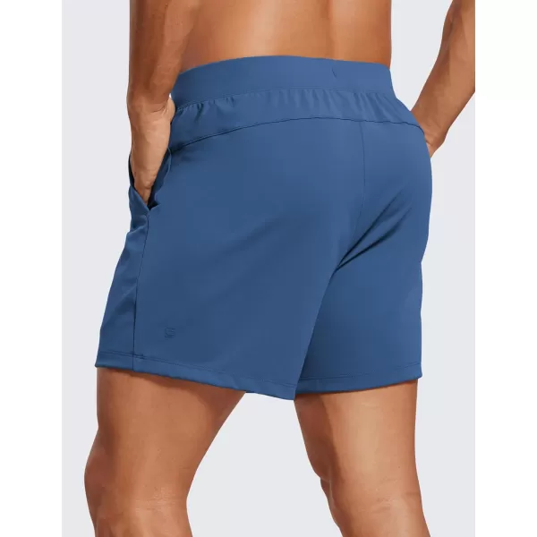 CRZ YOGA Mens FourWay Stretch Workout Shorts  5 Soft Durable Casual Athletic Shorts with Pocket Gym Running HikingPitch Blue