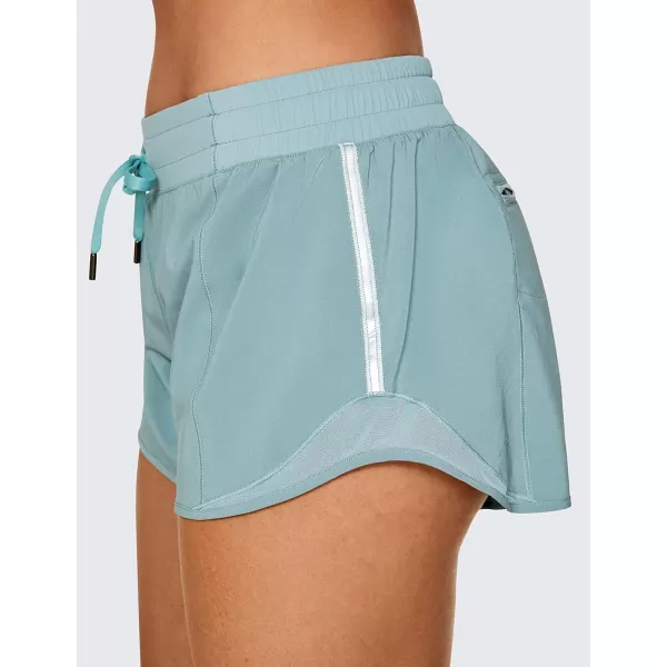 CRZ YOGA Athletic Shorts for Women with Zip Pocket 254 Mid Waist Mesh Liner Shorts for Running Gym WorkoutLight Grayish Blue