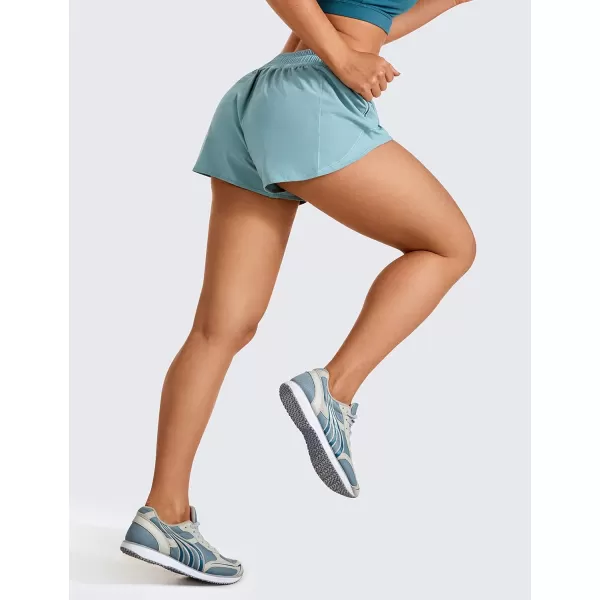 CRZ YOGA Athletic Shorts for Women with Zip Pocket 254 Mid Waist Mesh Liner Shorts for Running Gym WorkoutLight Grayish Blue