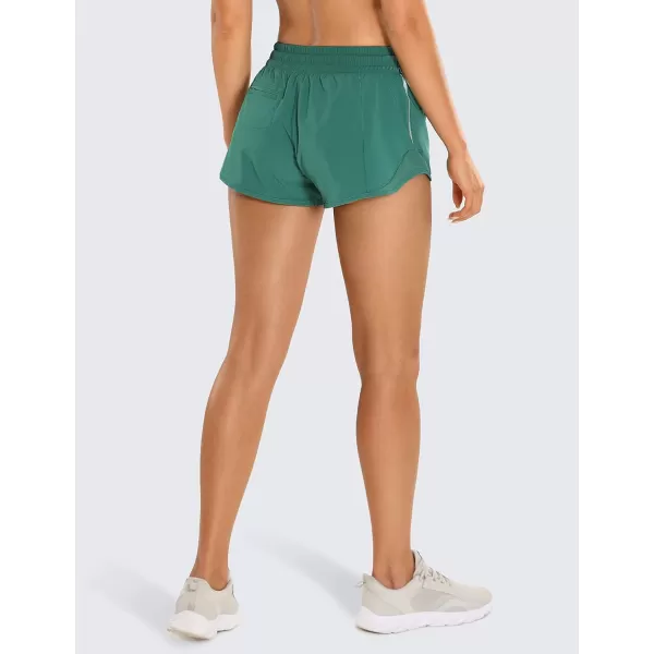 CRZ YOGA Athletic Shorts for Women with Zip Pocket 254 Mid Waist Mesh Liner Shorts for Running Gym WorkoutSmoky Green