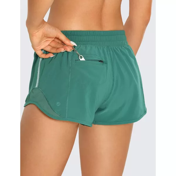 CRZ YOGA Athletic Shorts for Women with Zip Pocket 254 Mid Waist Mesh Liner Shorts for Running Gym WorkoutSmoky Green