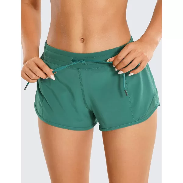 CRZ YOGA Athletic Shorts for Women with Zip Pocket 254 Mid Waist Mesh Liner Shorts for Running Gym WorkoutSmoky Green