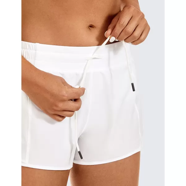 CRZ YOGA Athletic Shorts for Women with Zip Pocket 254 Mid Waist Mesh Liner Shorts for Running Gym WorkoutWhite