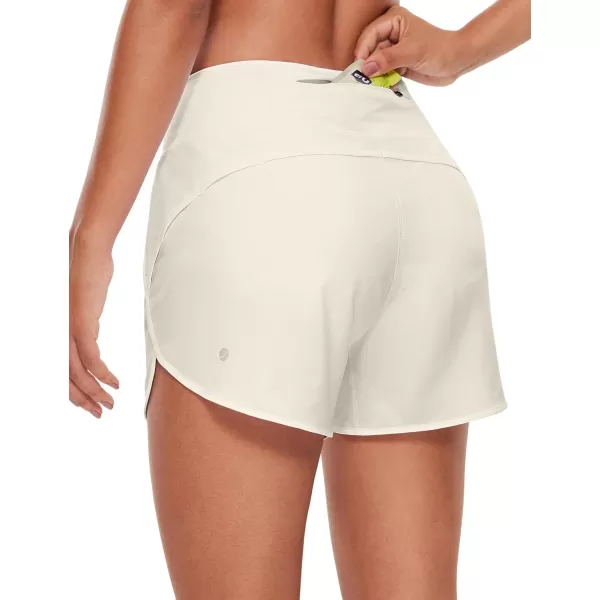 CRZ YOGA High Waisted Running Shorts for Women  254 Liner Gym Athletic Workout Shorts with Pockets Soft LightweightWhite Apricot