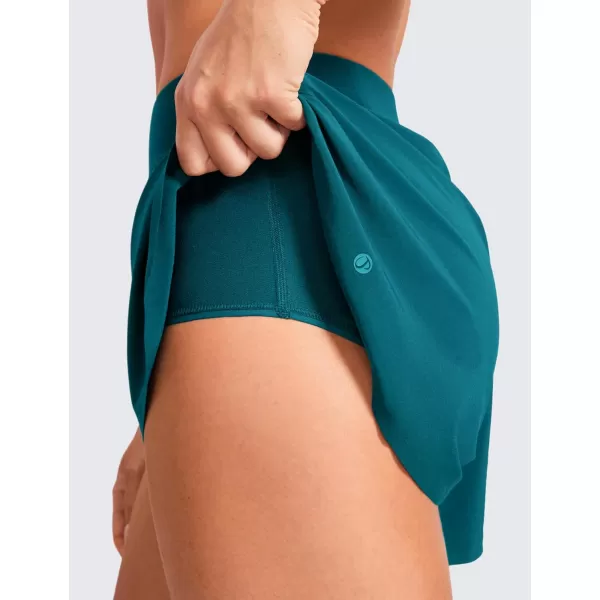 CRZ YOGA Mid Waisted Dolphin Athletic Shorts for Women Lightweight High Split Gym Workout Shorts with Liner Quick DryBorealis Green