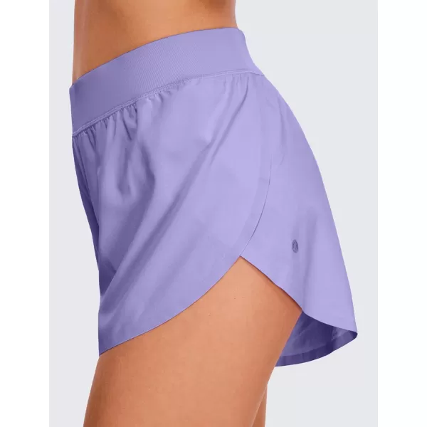 CRZ YOGA Mid Waisted Dolphin Athletic Shorts for Women Lightweight High Split Gym Workout Shorts with Liner Quick DryDark Lavender Purple