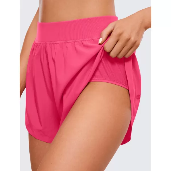 CRZ YOGA Mid Waisted Dolphin Athletic Shorts for Women Lightweight High Split Gym Workout Shorts with Liner Quick DryLip Gloss Pink