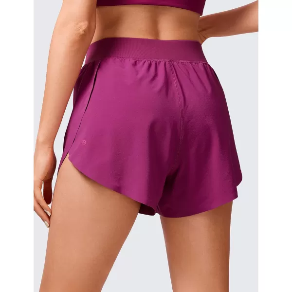 CRZ YOGA Mid Waisted Dolphin Athletic Shorts for Women Lightweight High Split Gym Workout Shorts with Liner Quick DryMagenta Purple