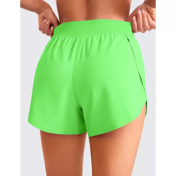 CRZ YOGA Mid Waisted Dolphin Athletic Shorts for Women Lightweight High Split Gym Workout Shorts with Liner Quick DryNeon Apple Green