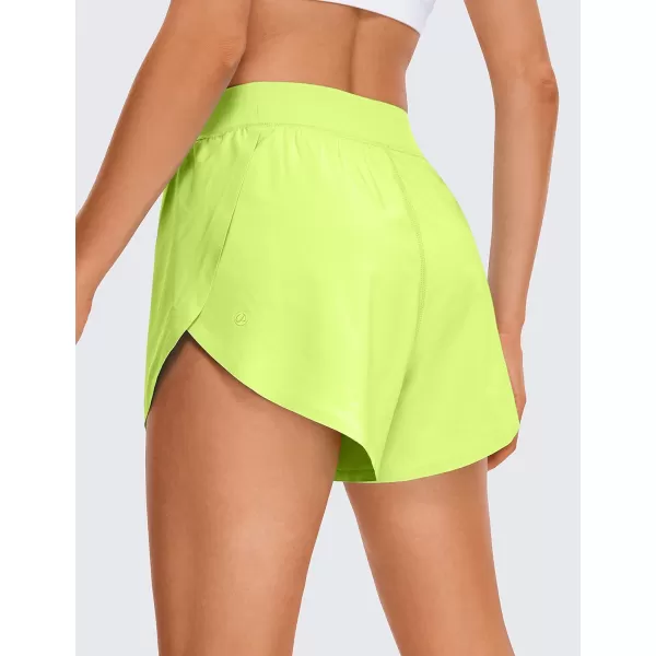 CRZ YOGA Mid Waisted Dolphin Athletic Shorts for Women Lightweight High Split Gym Workout Shorts with Liner Quick DryNeon Yellow