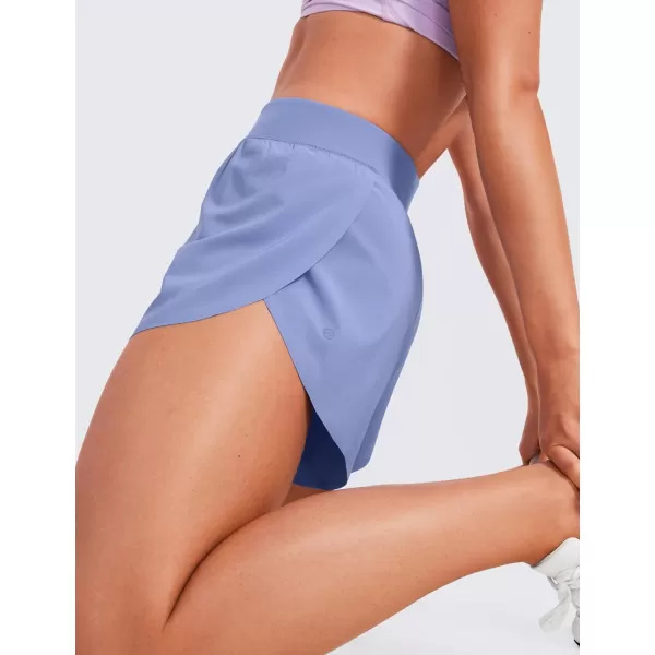 CRZ YOGA Mid Waisted Dolphin Athletic Shorts for Women Lightweight High Split Gym Workout Shorts with Liner Quick DryPeriwinkle Purple