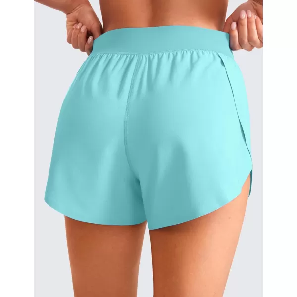 CRZ YOGA Mid Waisted Dolphin Athletic Shorts for Women Lightweight High Split Gym Workout Shorts with Liner Quick DryTurquoise