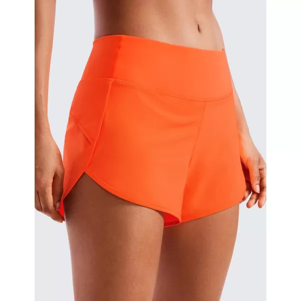 CRZ YOGA Mid Waisted Running Shorts for Women Soft Gym Athletic Workout Shorts with Zipper Pocket Liner Quick DryNeon Orange