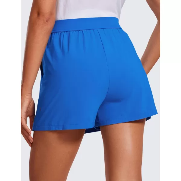 CRZ YOGA Skirt Overlay Shorts for Women High Waisted A Line Casual Golf Athletic Shorts with Pockets Cute Flat Front SkortSparkle Blue