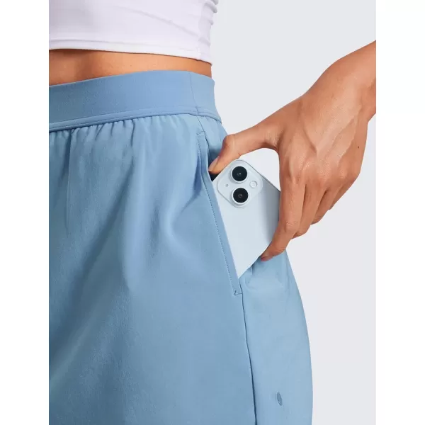 CRZ YOGA Skirt Overlay Shorts for Women High Waisted A Line Casual Golf Athletic Shorts with Pockets Cute Flat Front SkortUniverse Blue