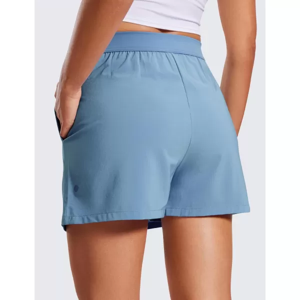 CRZ YOGA Skirt Overlay Shorts for Women High Waisted A Line Casual Golf Athletic Shorts with Pockets Cute Flat Front SkortUniverse Blue