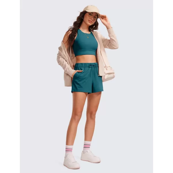 CRZ YOGA Stretch Shorts for Women Work Casual 25  Athletic Shorts with Pockets for Workout Travel Hiking GolfBorealis Green