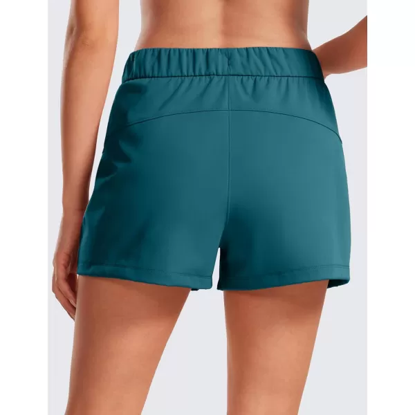 CRZ YOGA Stretch Shorts for Women Work Casual 25  Athletic Shorts with Pockets for Workout Travel Hiking GolfBorealis Green