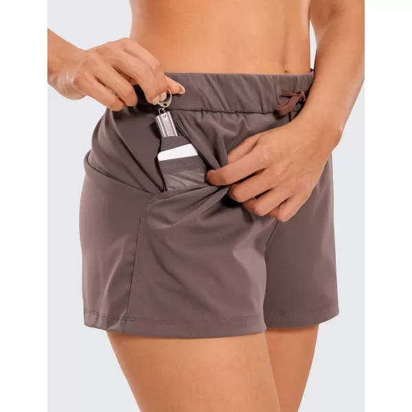 CRZ YOGA Stretch Shorts for Women Work Casual 25  Athletic Shorts with Pockets for Workout Travel Hiking GolfBrown Rock