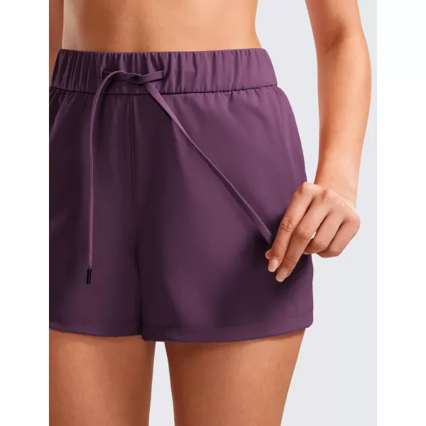 CRZ YOGA Stretch Shorts for Women Work Casual 25  Athletic Shorts with Pockets for Workout Travel Hiking GolfDeep Purple