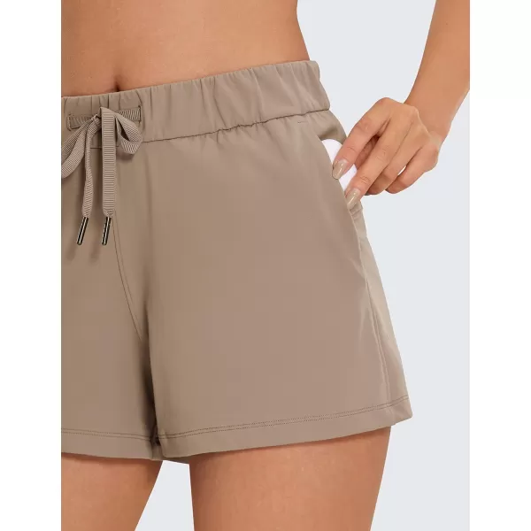 CRZ YOGA Stretch Shorts for Women Work Casual 25  Athletic Shorts with Pockets for Workout Travel Hiking GolfKhaki Fog