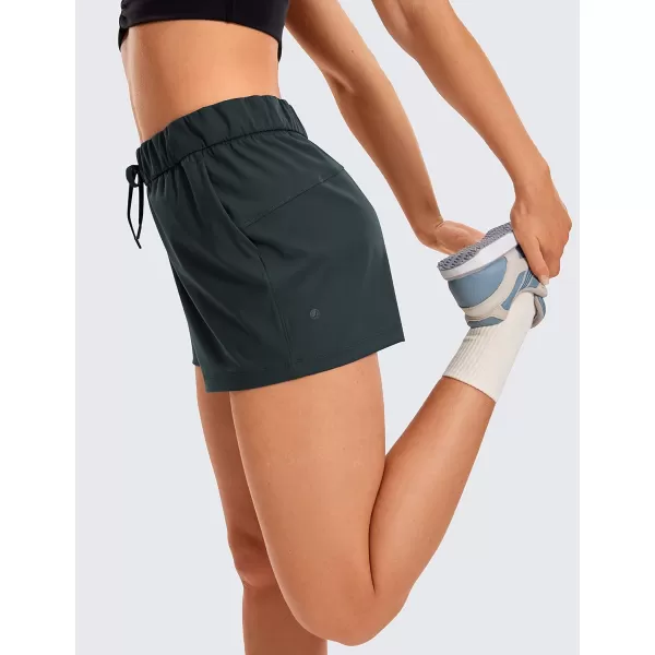 CRZ YOGA Stretch Shorts for Women Work Casual 25  Athletic Shorts with Pockets for Workout Travel Hiking GolfMelanite