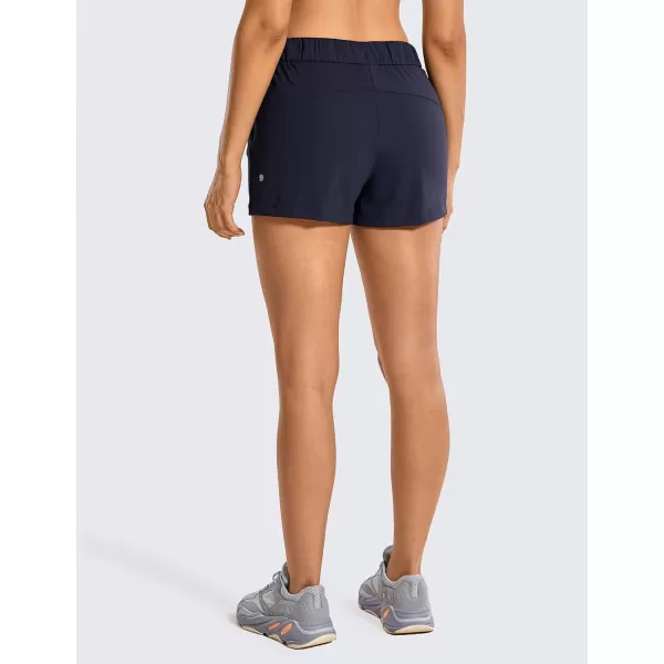 CRZ YOGA Stretch Shorts for Women Work Casual 25  Athletic Shorts with Pockets for Workout Travel Hiking GolfNavy